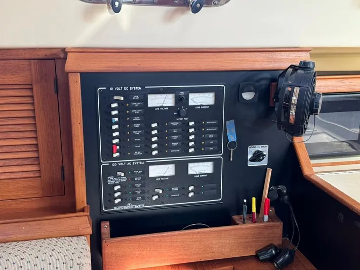 TinteÁn Yacht Photos Pics Electrical panel on a 2000 Island Packet 40 sailboat, featuring switches and controls.