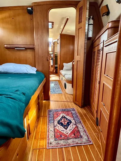 TinteÁn Yacht Photos Pics Interior of 2000 Island Packet 40 sailboat with wooden finish and cozy cabin layout.