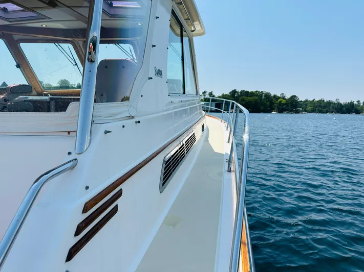 Slipped Away Yacht Photos Pics 2008 Sabre 42 Hardtop Express yacht on calm water, showcasing sleek design and craftsmanship.