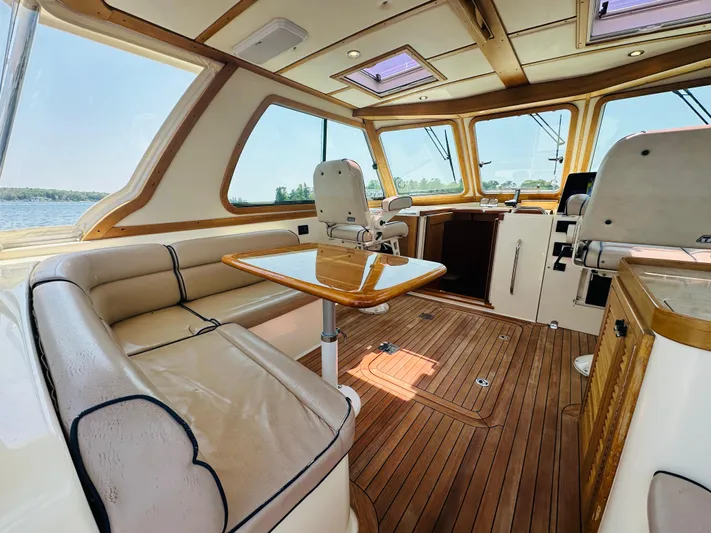 Slipped Away Yacht Photos Pics 2008 Sabre 42 Hardtop Express interior with wood flooring and leather seating.