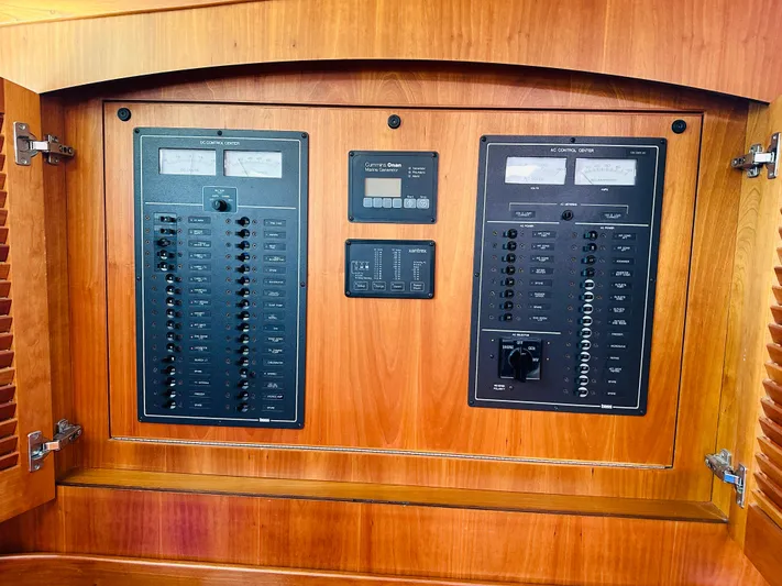 Slipped Away Yacht Photos Pics Electrical panel inside 2008 Sabre 42 Hardtop Express yacht, featuring control switches and meters.