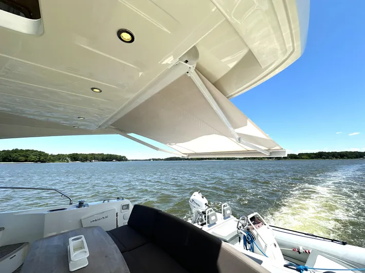  Yacht Photos Pics Prestige 500 yacht, 2017 model, cruising on a sunny lake with retractable awning.