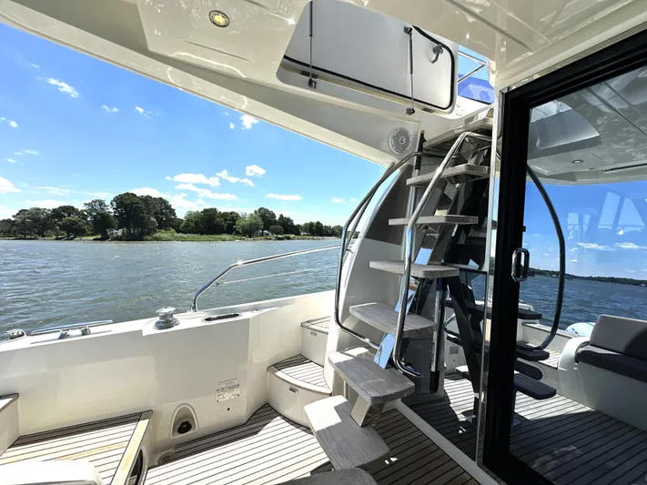  Yacht Photos Pics Luxurious 2017 Prestige 500 yacht deck with spiral staircase and scenic water view.