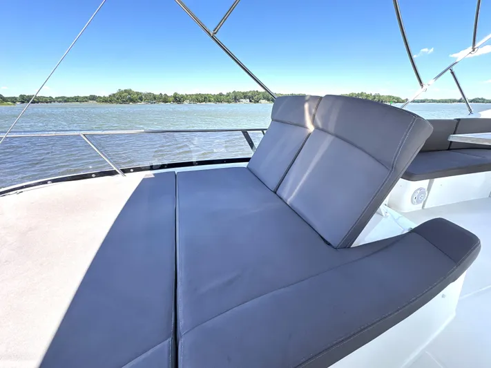  Yacht Photos Pics Luxurious seating on 2017 Prestige 500 yacht, overlooking serene waters.