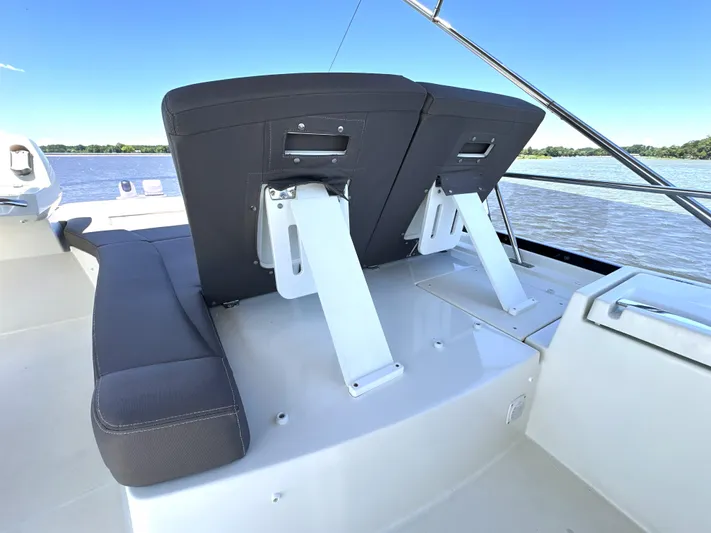  Yacht Photos Pics Luxury seating on 2017 Prestige 500 yacht, overlooking serene water.