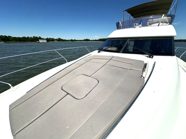  Yacht Photos Pics 2017 Prestige 500 yacht on water, featuring spacious sun deck and sleek design.