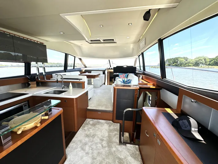  Yacht Photos Pics Luxurious interior of a 2017 Prestige 500 yacht with modern kitchen and scenic views.
