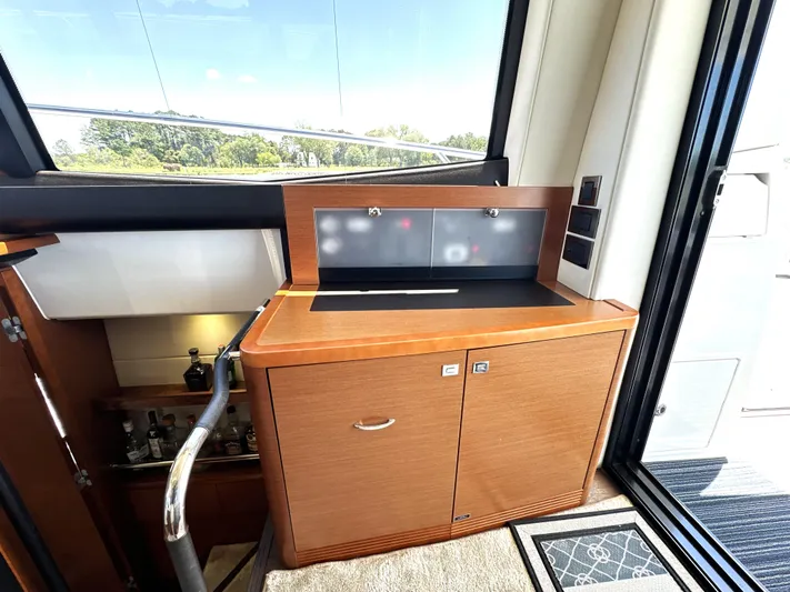  Yacht Photos Pics Luxurious interior of a 2017 Prestige 500 yacht with wooden cabinetry and modern design.