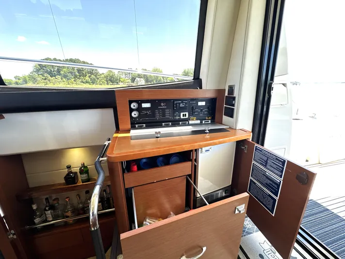  Yacht Photos Pics Control panel and bar area inside a 2017 Prestige 500 yacht.