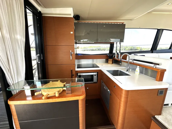  Yacht Photos Pics Luxurious kitchen interior of a 2017 Prestige 500 yacht with modern amenities.