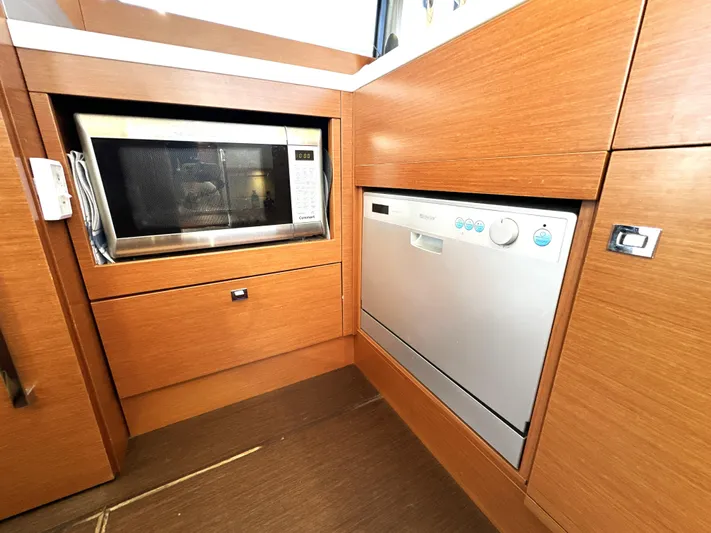  Yacht Photos Pics Modern kitchen area in a 2017 Prestige 500 yacht with microwave and dishwasher.