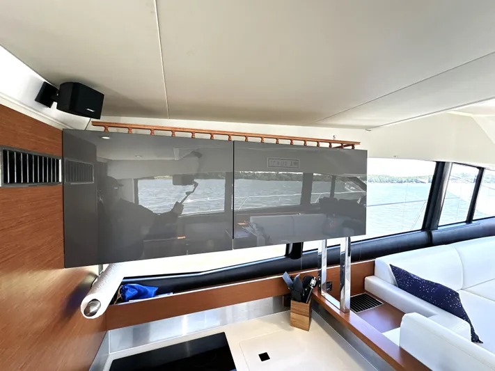  Yacht Photos Pics Interior of 2017 Prestige 500 yacht with modern cabinetry and scenic window view.