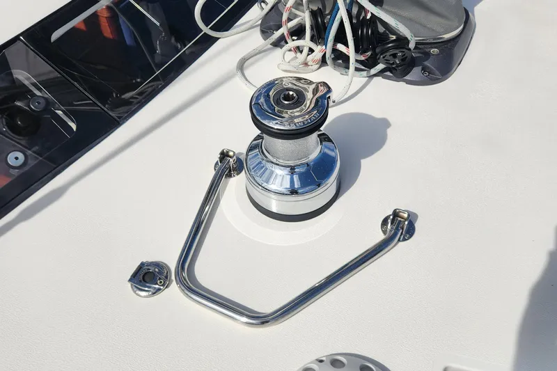 Pinnacle Yacht Photos Pics Deck winch on 2023 Hallberg-Rassy 57 yacht, featuring sleek chrome finish and rigging.