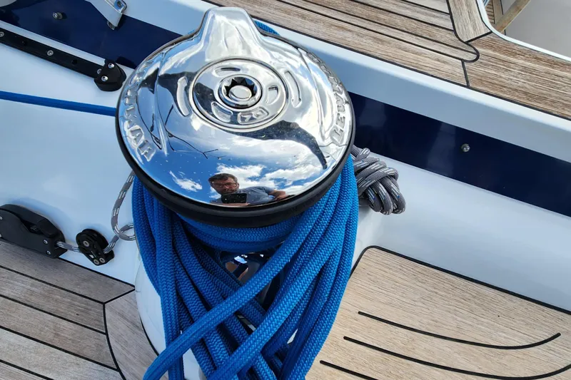 Pinnacle Yacht Photos Pics 2023 Hallberg-Rassy 57 yacht winch with blue ropes on teak deck.