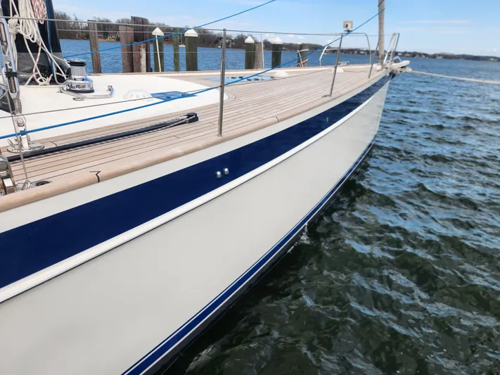 Pinnacle Yacht Photos Pics 2023 Hallberg-Rassy 57 yacht docked, showcasing sleek design and craftsmanship.