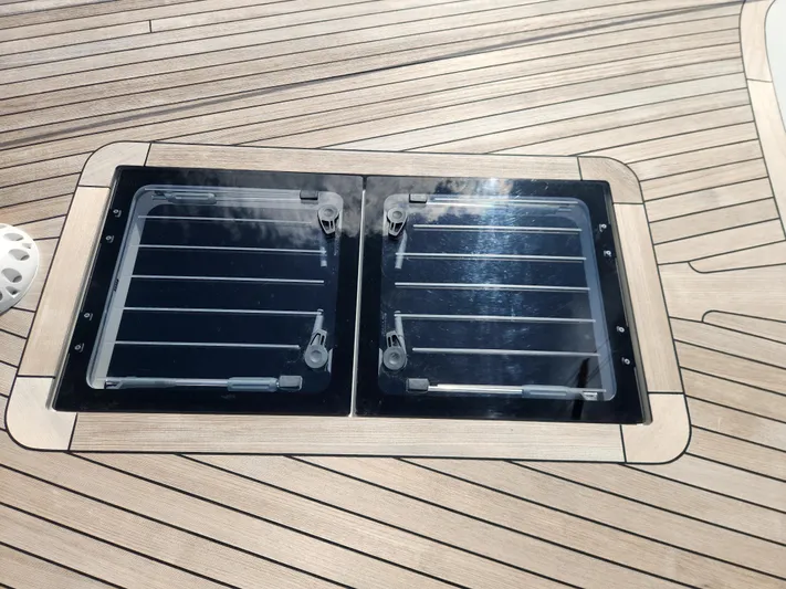 Pinnacle Yacht Photos Pics 2023 Hallberg-Rassy 57 yacht deck with dual skylights and teak finish.