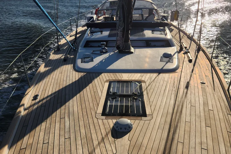 Pinnacle Yacht Photos Pics 2023 Hallberg-Rassy 57 yacht deck with sleek design and wooden finish.