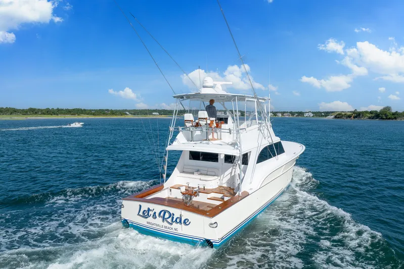 Let's Ride Yacht Photos Pics 2004 Sculley Custom Carolina 58' Sportfish yacht cruising on blue ocean waters.
