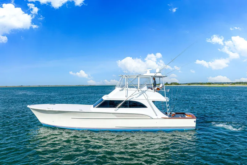 Let's Ride Yacht Photos Pics 2004 Sculley Custom Carolina 58' Sportfish yacht cruising on open water under blue skies.