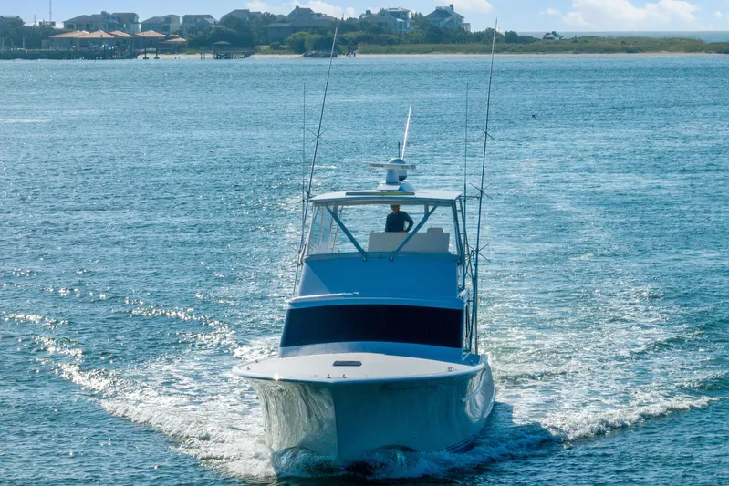 Let's Ride Yacht Photos Pics 2004 Sculley Custom Carolina 58' Sportfish cruising on open water.
