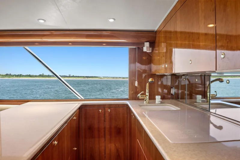Let's Ride Yacht Photos Pics Luxurious kitchen interior of 2004 Sculley Custom Carolina 58' Sportfish yacht with ocean view.