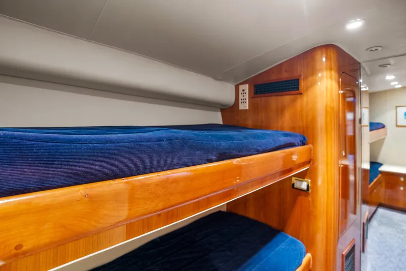 Let's Ride Yacht Photos Pics Interior of 2004 Sculley Custom Carolina 58' Sportfish with wooden bunk beds.