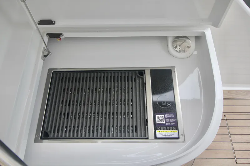 Let's Ride Yacht Photos Pics Built-in Kenyon grill on 2004 Sculley Custom Carolina 58' Sportfish yacht deck.