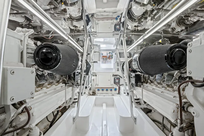 Let's Ride Yacht Photos Pics Engine room of 2004 Sculley Custom Carolina 58' Sportfish, showcasing dual engines and mechanical systems.