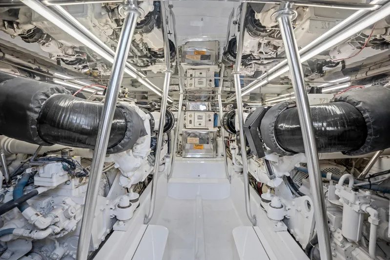 Let's Ride Yacht Photos Pics Engine room of 2004 Sculley Custom Carolina 58' Sportfish, showcasing dual engines and mechanical systems.