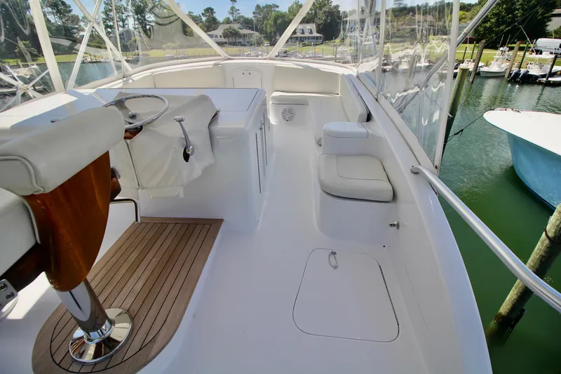 Let's Ride Yacht Photos Pics 2004 Sculley Custom Carolina 58' Sportfish yacht interior with helm and seating area.