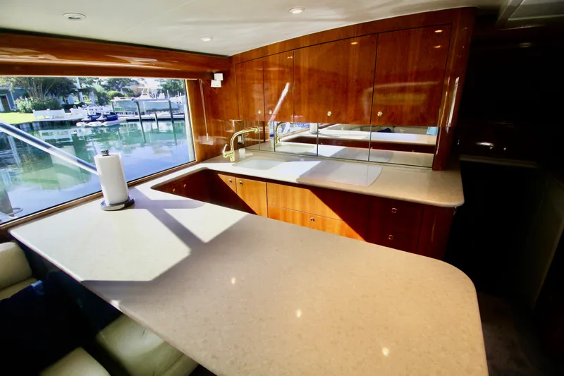 Let's Ride Yacht Photos Pics Luxurious kitchen interior of 2004 Sculley Custom Carolina 58' Sportfish yacht.