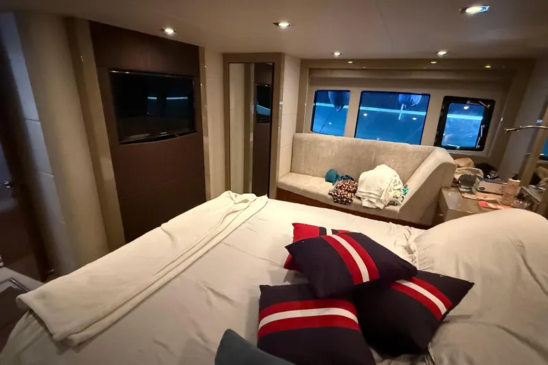 Helios Yacht Photos Pics Luxurious interior of 2010 Sunseeker Predator 60 yacht with cozy seating and modern amenities.