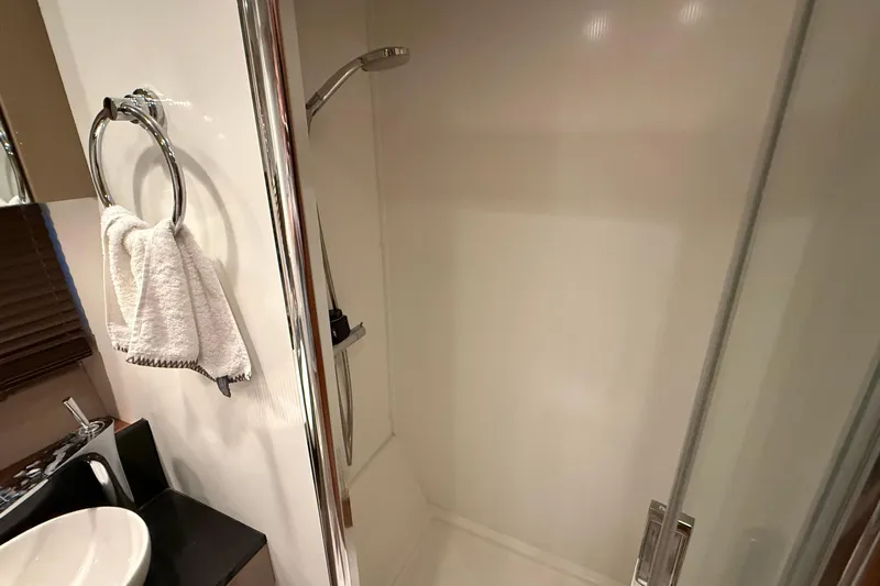 Helios Yacht Photos Pics Shower area in 2010 Sunseeker Predator 60 yacht, featuring modern fixtures and towel ring.