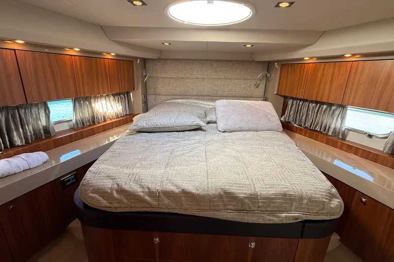 Helios Yacht Photos Pics Luxurious cabin interior of 2010 Sunseeker Predator 60 yacht with elegant wood finishes.