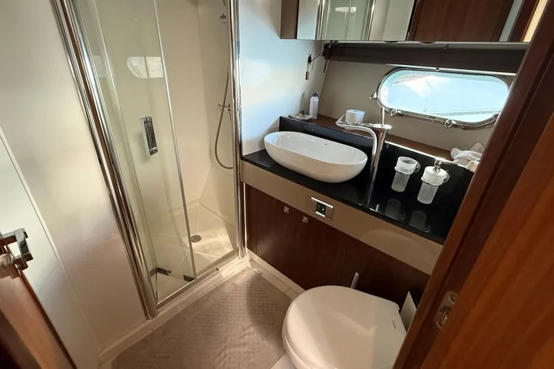 Helios Yacht Photos Pics Luxurious bathroom in 2010 Sunseeker Predator 60 yacht with modern fixtures and shower.