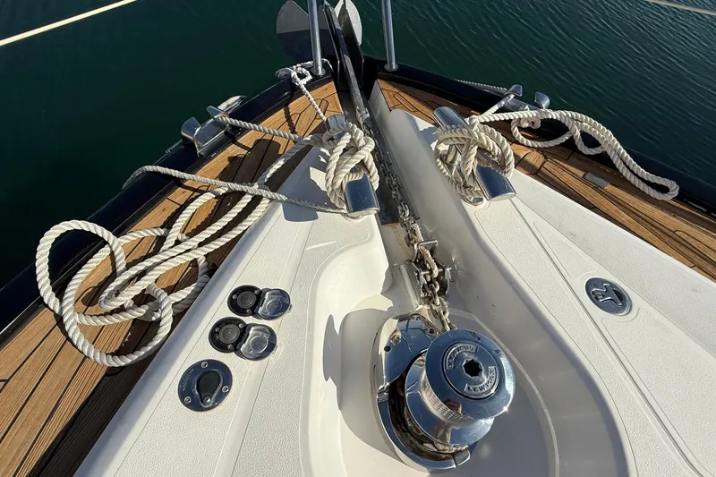 Helios Yacht Photos Pics Bow of 2010 Sunseeker Predator 60 yacht with anchor and ropes.