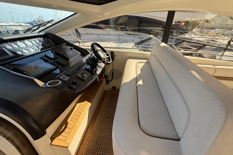 Helios Yacht Photos Pics Interior of 2010 Sunseeker Predator 60 yacht with modern helm and seating area.