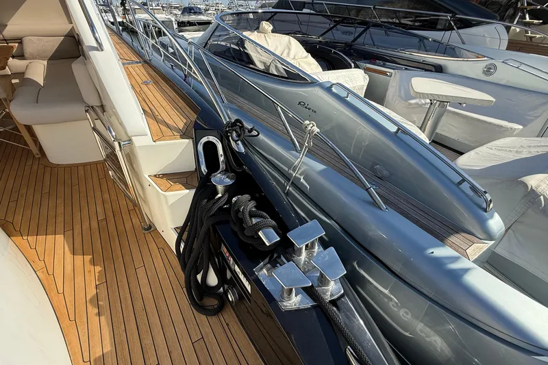 Helios Yacht Photos Pics Luxurious 2010 Sunseeker Predator 60 yacht with sleek deck and elegant seating area.