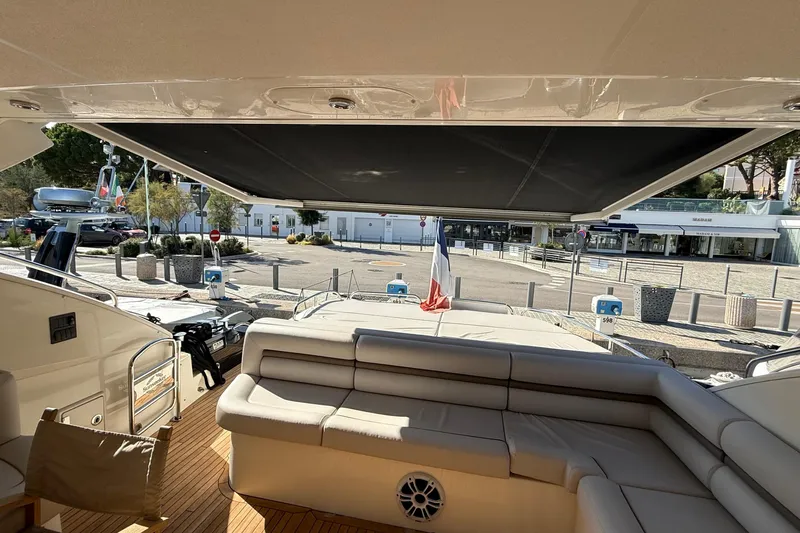 Helios Yacht Photos Pics Sunseeker Predator 60 yacht interior, 2010 model, featuring luxurious seating and retractable sunshade.