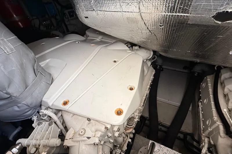 Helios Yacht Photos Pics Engine compartment of a 2010 Sunseeker Predator 60 yacht, showcasing mechanical components.