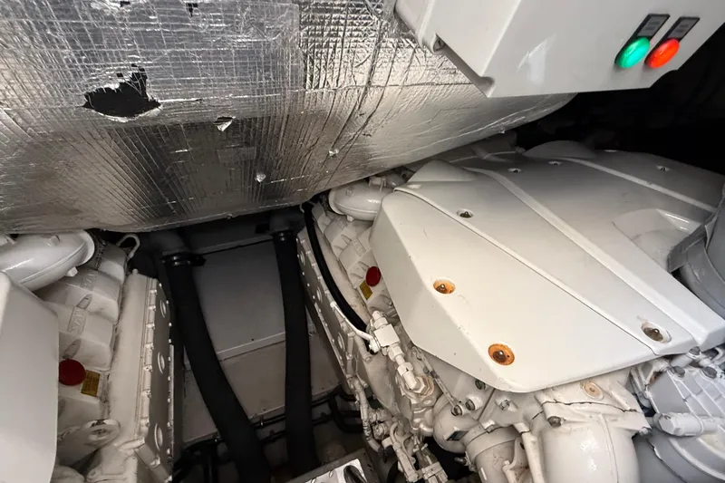 Helios Yacht Photos Pics Engine room of a 2010 Sunseeker Predator 60 yacht, showcasing mechanical components.