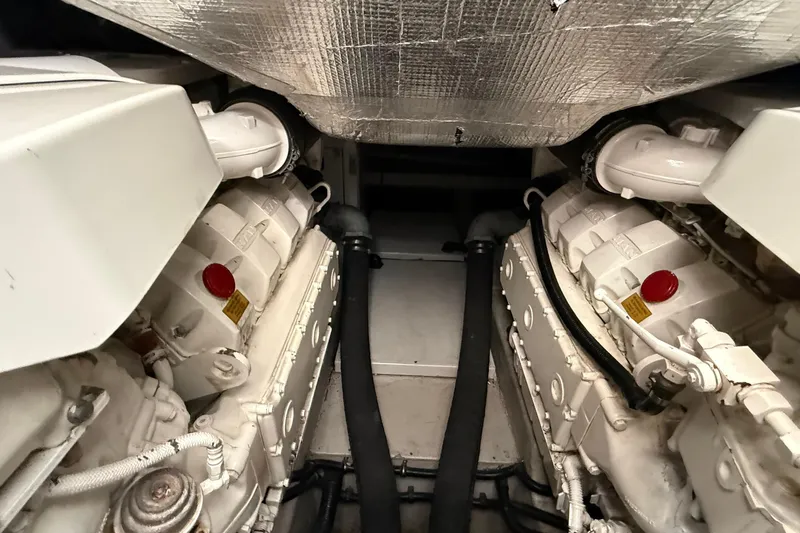 Helios Yacht Photos Pics Engine room of 2010 Sunseeker Predator 60 yacht, showcasing dual engines and mechanical components.