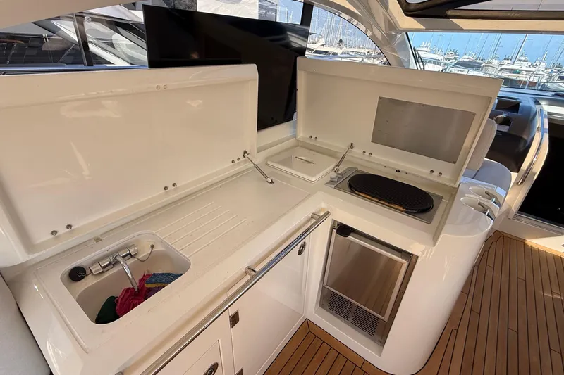 Helios Yacht Photos Pics Luxurious Sunseeker Predator 60 yacht kitchen with sink, grill, and refrigerator, 2010 model.
