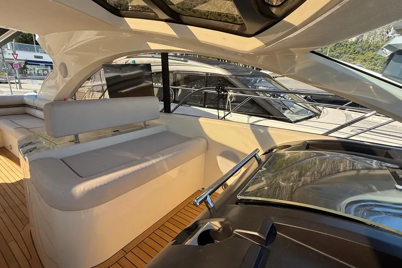 Helios Yacht Photos Pics Luxurious interior of 2010 Sunseeker Predator 60 yacht with sleek seating and modern design.