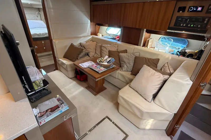 Helios Yacht Photos Pics Luxurious interior of a 2010 Sunseeker Predator 60 yacht with plush seating and modern amenities.
