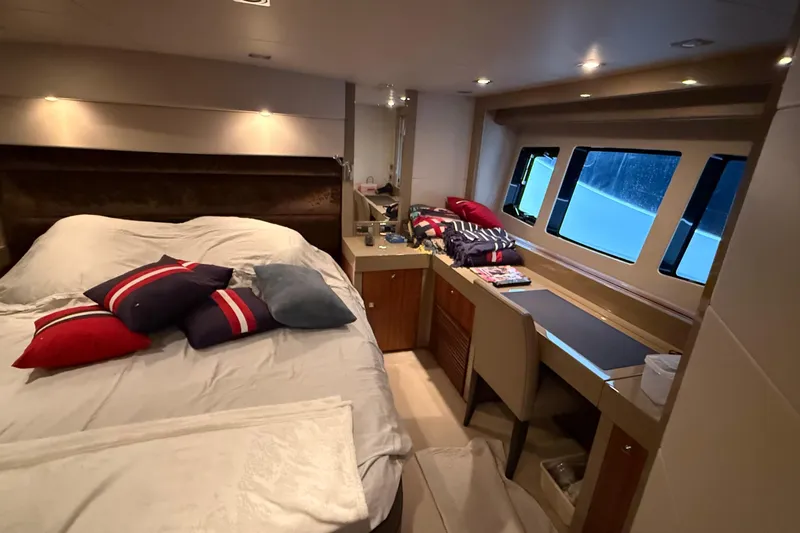 Helios Yacht Photos Pics Luxurious cabin interior of 2010 Sunseeker Predator 60 yacht with bed and windows.