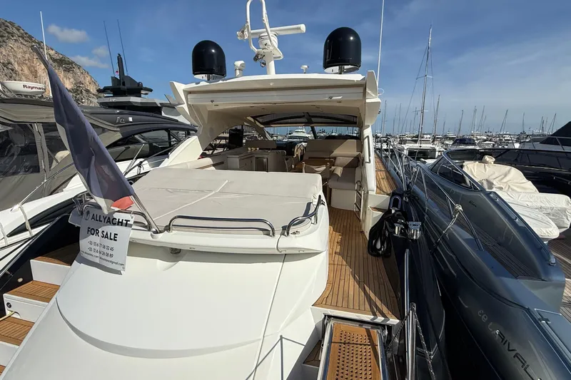 Helios Yacht Photos Pics 2010 Sunseeker Predator 60 yacht for sale, docked in marina, luxury vessel.