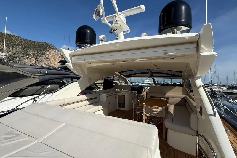 Helios Yacht Photos Pics Luxurious 2010 Sunseeker Predator 60 yacht interior with spacious seating and elegant design.