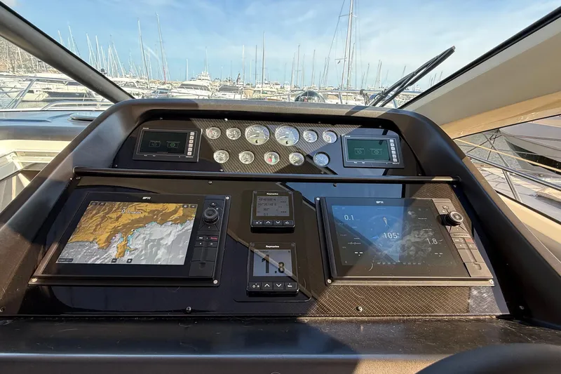Helios Yacht Photos Pics Helm of 2010 Sunseeker Predator 60 yacht with advanced navigation displays.
