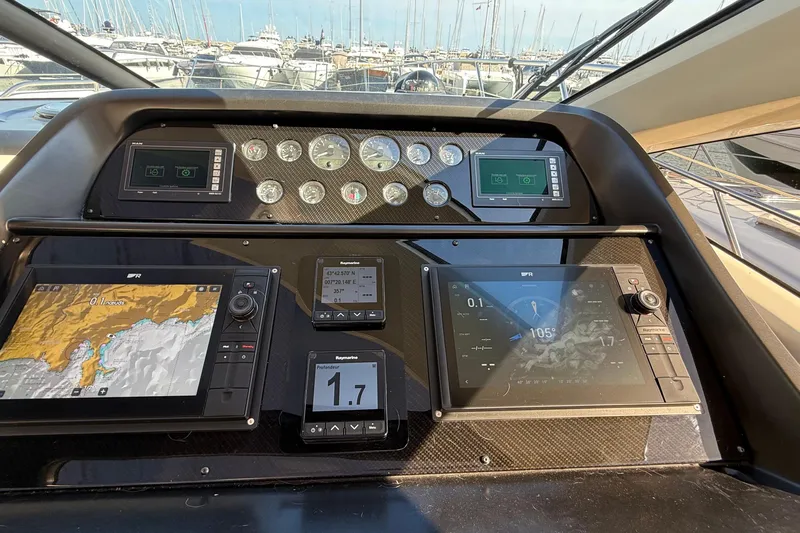 Helios Yacht Photos Pics Cockpit of 2010 Sunseeker Predator 60 yacht with navigation displays and controls.